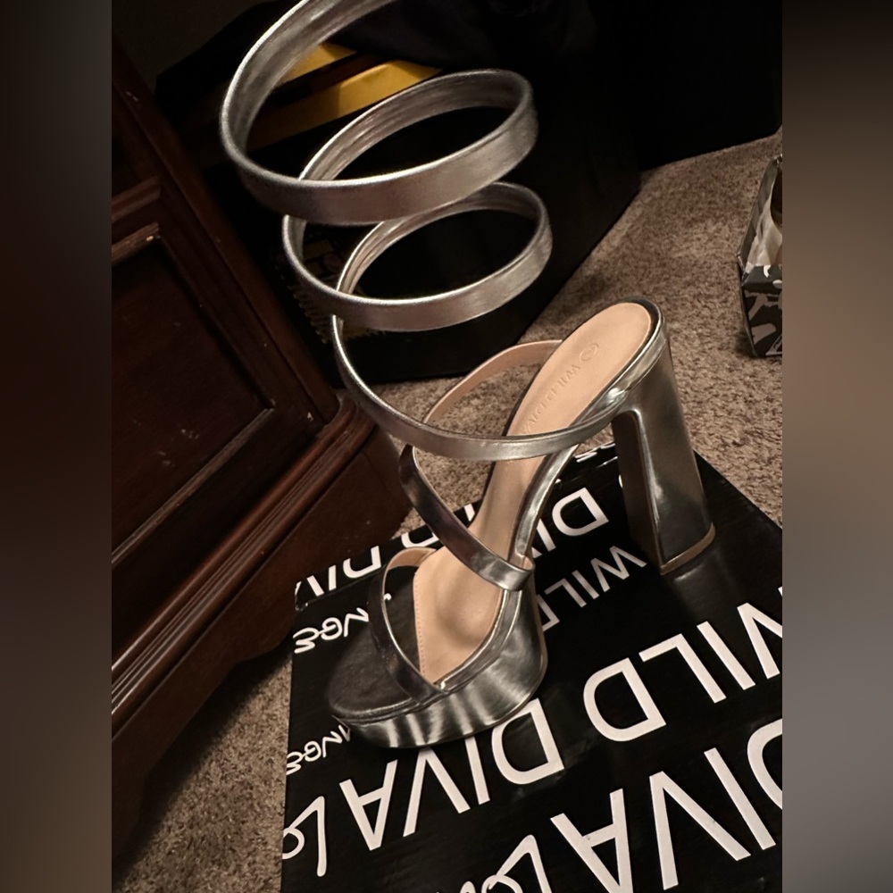 Brand new heels , silver size 7